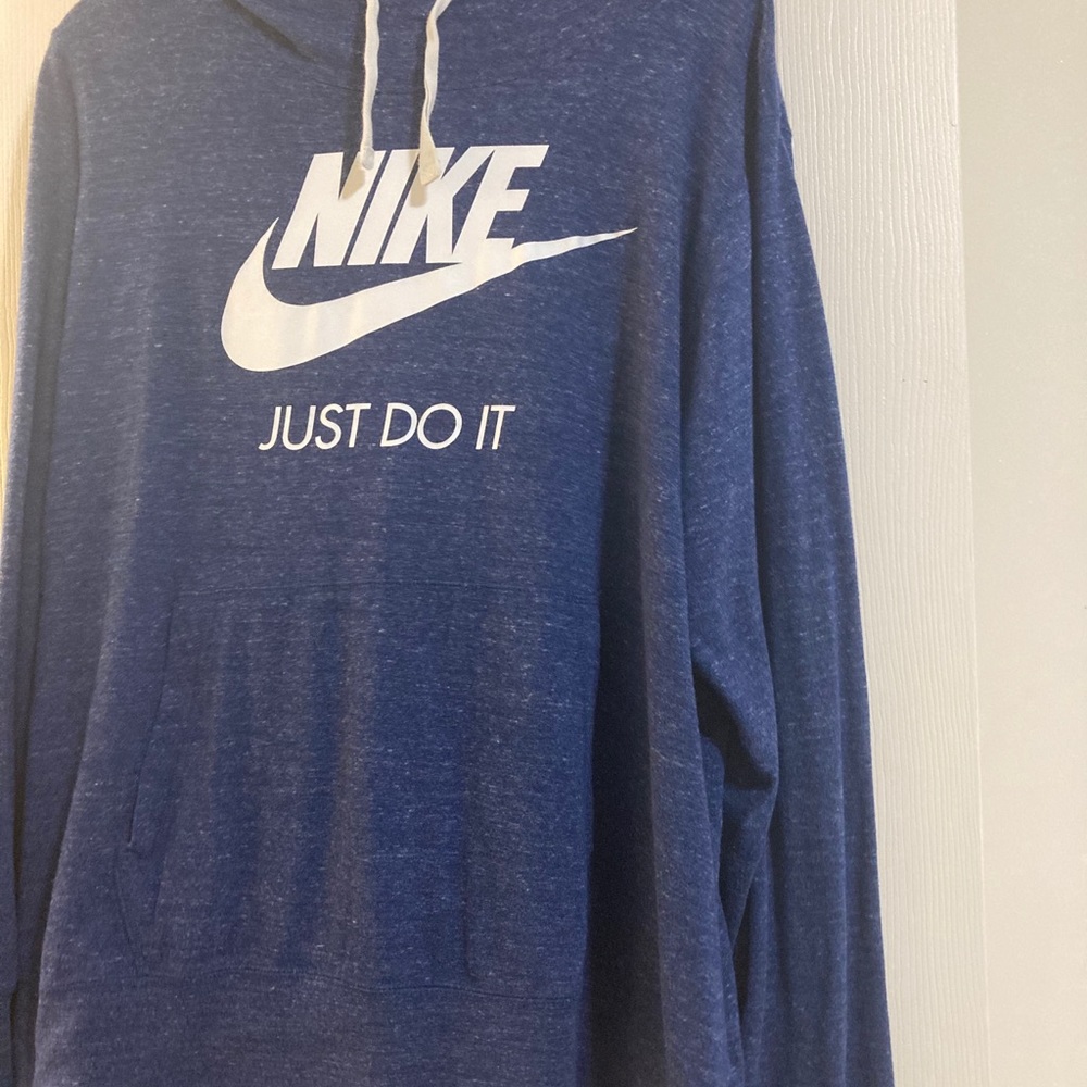 Light Nike sweater.
